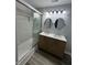 This bathroom features double sinks, new paint, new floors, and a shower at 4457 Campbell Ave, Indianapolis, IN 46226