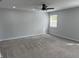 This bedroom has a ceiling fan, new paint, new carpet, and a window at 4457 Campbell Ave, Indianapolis, IN 46226