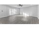 Empty bedroom featuring a fan, neutral walls, and ample natural light from a large window at 4457 Campbell Ave, Indianapolis, IN 46226