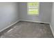 This bedroom has new paint, new carpet, and a window at 4457 Campbell Ave, Indianapolis, IN 46226