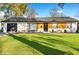 Charming single-story home with lush green lawn and landscaping at 4457 Campbell Ave, Indianapolis, IN 46226
