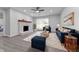 Comfortable living room featuring a classic brick fireplace, modern furniture, and soft decor at 4457 Campbell Ave, Indianapolis, IN 46226
