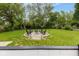 Spacious backyard featuring a cozy fire pit area and lush green lawn at 4482 Priscilla Ave, Indianapolis, IN 46226