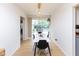 Bright dining room boasts modern light fixture, sleek dining set, and a scenic backyard view at 4482 Priscilla Ave, Indianapolis, IN 46226