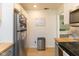 View of the kitchen features stainless steel refrigerator and butcher block countertops at 4482 Priscilla Ave, Indianapolis, IN 46226