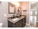 Bathroom with double vanity, dark cabinets and gray walls at 450 Columbia Ct, Greenwood, IN 46142