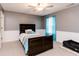 Comfortable bedroom with a bed, neutral walls, and a window with curtains at 450 Columbia Ct, Greenwood, IN 46142