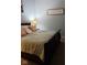 Comfortable bedroom with wood-trimmed bed, plush pillows, and cozy lighting at 450 Columbia Ct, Greenwood, IN 46142