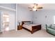 Primary bedroom featuring blue walls, ceiling fan, and reading lights at 450 Columbia Ct, Greenwood, IN 46142