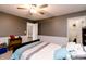 Bedroom with a blue comforter, ceiling fan, and white trim at 450 Columbia Ct, Greenwood, IN 46142