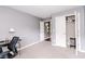 Neutral bedroom featuring gray walls, carpet, and closet with white doors at 450 Columbia Ct, Greenwood, IN 46142