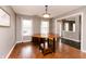 Elegant dining room with hardwood floors and ample natural light, creating an inviting atmosphere at 450 Columbia Ct, Greenwood, IN 46142