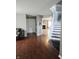 Welcoming foyer with wood floors, stairs, and a view into the living room at 450 Columbia Ct, Greenwood, IN 46142