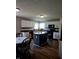 Well-equipped kitchen with white cabinets, dark countertops, and black appliances, offering ample space at 450 Columbia Ct, Greenwood, IN 46142