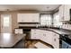 Kitchen featuring white cabinets, stainless steel appliances, and stone countertops at 450 Columbia Ct, Greenwood, IN 46142