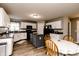 Bright kitchen featuring white cabinets, a central island, and modern appliances at 450 Columbia Ct, Greenwood, IN 46142