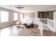 Bright upper living room featuring a wooden staircase at 450 Columbia Ct, Greenwood, IN 46142