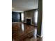 Spacious living room featuring hardwood floors, fireplace, and soft natural light creating a warm and inviting ambiance at 450 Columbia Ct, Greenwood, IN 46142