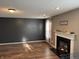 Spacious living room featuring a fireplace, wood floors, and natural light at 450 Columbia Ct, Greenwood, IN 46142