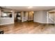 Open-concept living space with hardwood floors and views into the modern kitchen at 450 Columbia Ct, Greenwood, IN 46142