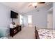 Light and airy main bedroom with light blue walls, carpet, and a ceiling fan at 450 Columbia Ct, Greenwood, IN 46142
