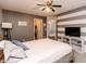 Comfortable main bedroom with striped accent wall and ensuite bathroom and walk-in closet at 450 Columbia Ct, Greenwood, IN 46142