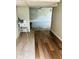Basement space featuring two different flooring types and a highchair at 4850 E University Ave, Indianapolis, IN 46201