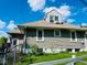 A well maintained home featuring horizontal siding and a dormer window at 4850 E University Ave, Indianapolis, IN 46201
