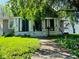 Charming home featuring a cozy front porch and a well-maintained lawn at 4850 E University Ave, Indianapolis, IN 46201