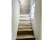View of the wooden staircase with a window, creating bright natural light at 4850 E University Ave, Indianapolis, IN 46201