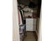 Functional walk-in closet with built-in shelving, a dresser, and ample storage space, maximizing organization at 4850 E University Ave, Indianapolis, IN 46201