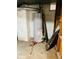 Water heater installed in the basement of the home with tool on floor at 4850 E University Ave, Indianapolis, IN 46201