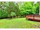 Scenic view of a lush backyard blending seamlessly with the surrounding wooded landscape at 504 W Gold Creek Rd, Mooresville, IN 46158