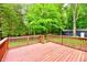 A wood deck offers a view of a wooded backyard at 504 W Gold Creek Rd, Mooresville, IN 46158