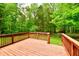 Wood deck overlooking a backyard with beautiful green trees and grass at 504 W Gold Creek Rd, Mooresville, IN 46158