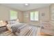 Charming bedroom staged with a crib and queen bed, perfect for a Bedroom or guest room at 504 W Gold Creek Rd, Mooresville, IN 46158