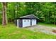 Detached two-car garage with white doors, situated on a well-maintained lawn at 504 W Gold Creek Rd, Mooresville, IN 46158