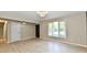 Inviting living room with large window, wood-look flooring, and neutral walls at 504 W Gold Creek Rd, Mooresville, IN 46158