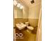 A half bath featuring a tiled backsplash and standard toilet at 5222 Nob Ln, Indianapolis, IN 46226