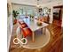Cozy dining room with wood floors and a large table with seating for six at 5222 Nob Ln, Indianapolis, IN 46226