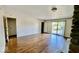 Spacious living room boasting hardwood floors and sliding glass doors to a private balcony at 5222 Nob Ln, Indianapolis, IN 46226