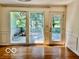 Bright living room featuring large windows and a glass door to the outdoors at 5222 Nob Ln, Indianapolis, IN 46226
