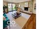 Cozy living room boasts natural light, a stone fireplace, and comfortable seating at 5222 Nob Ln, Indianapolis, IN 46226