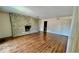 Large living room featuring gleaming hardwood floors and a beautiful stone fireplace at 5222 Nob Ln, Indianapolis, IN 46226