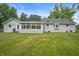 Expansive backyard featuring a well-maintained lawn, perfect for outdoor activities and relaxation at 5330 W 56Th St, Indianapolis, IN 46254