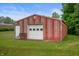 Rustic barn with red siding and bench at 5330 W 56Th St, Indianapolis, IN 46254