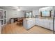 Bright kitchen and dining area featuring white cabinetry, matching appliances, and natural light at 5330 W 56Th St, Indianapolis, IN 46254