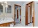 Bathroom featuring a sink, vanity, mirror, and access to other rooms at 5372 Bay Harbor Dr, Indianapolis, IN 46254