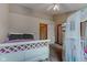 Cozy bedroom with a white-framed bed, vaulted ceiling, and neutral color palette at 5372 Bay Harbor Dr, Indianapolis, IN 46254