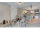 Cozy dining area adjacent to an open-concept kitchen, and a large window at 5372 Bay Harbor Dr, Indianapolis, IN 46254